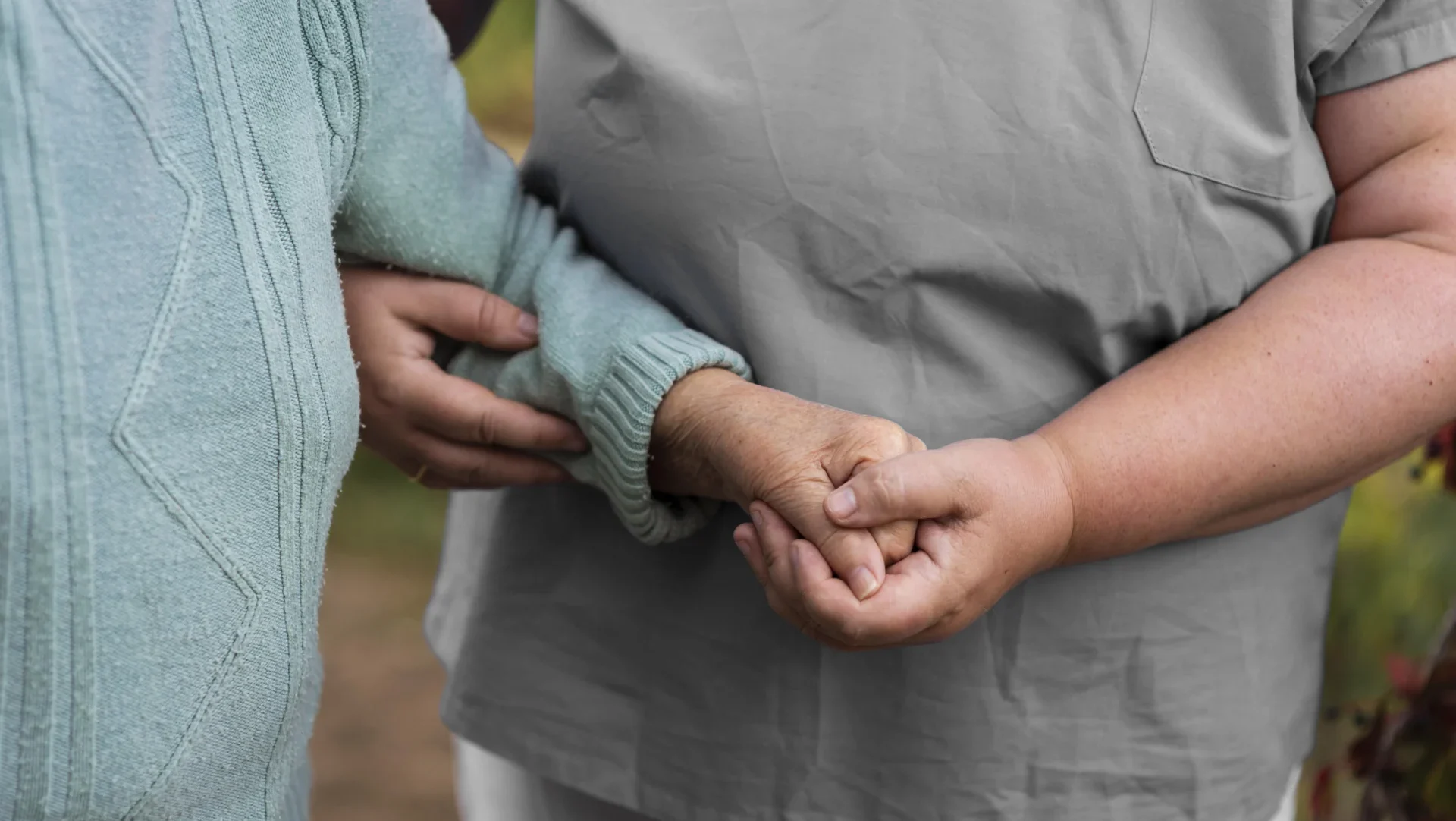 Female Nurse Helping Older Woman Walk